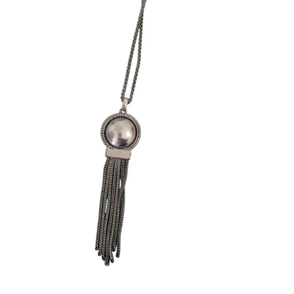 Long silver necklace with round pendant